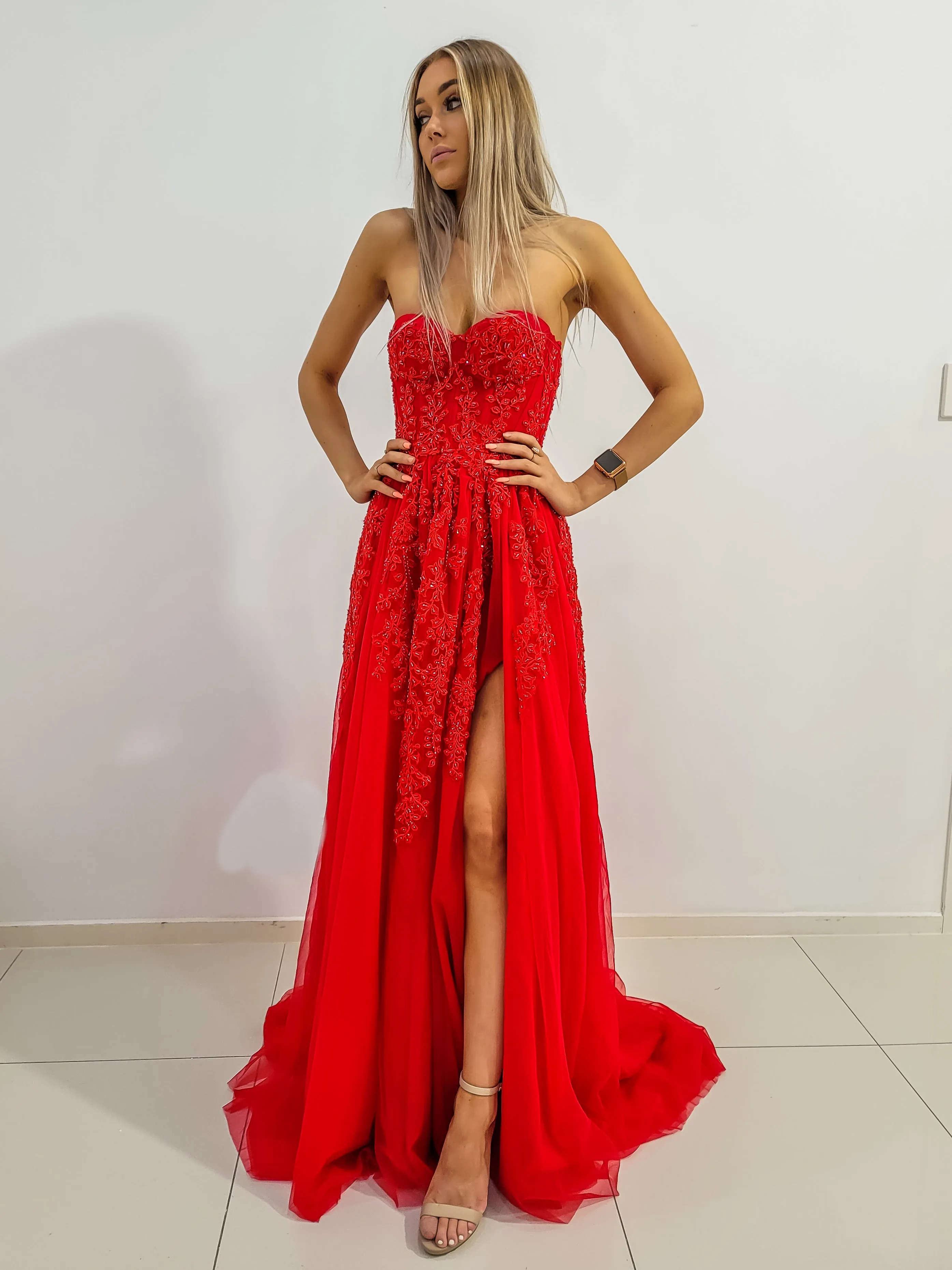Red bustier top tulle dress with slit for hire