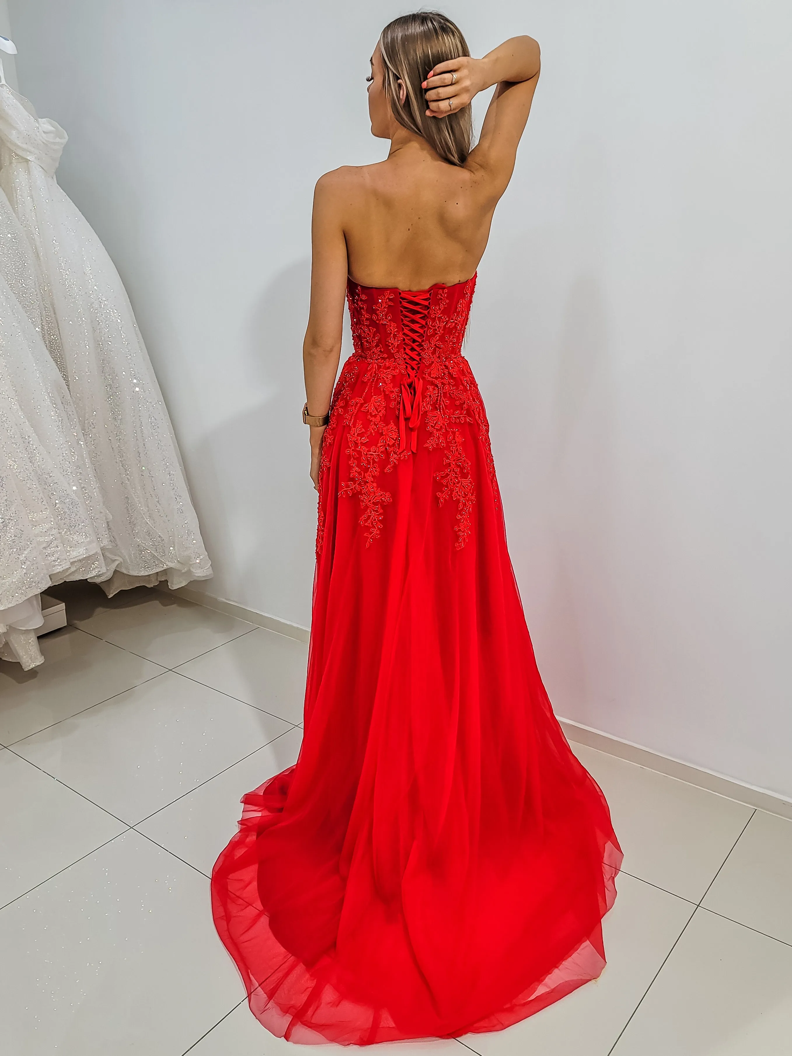 Red bustier top tulle dress with slit for hire