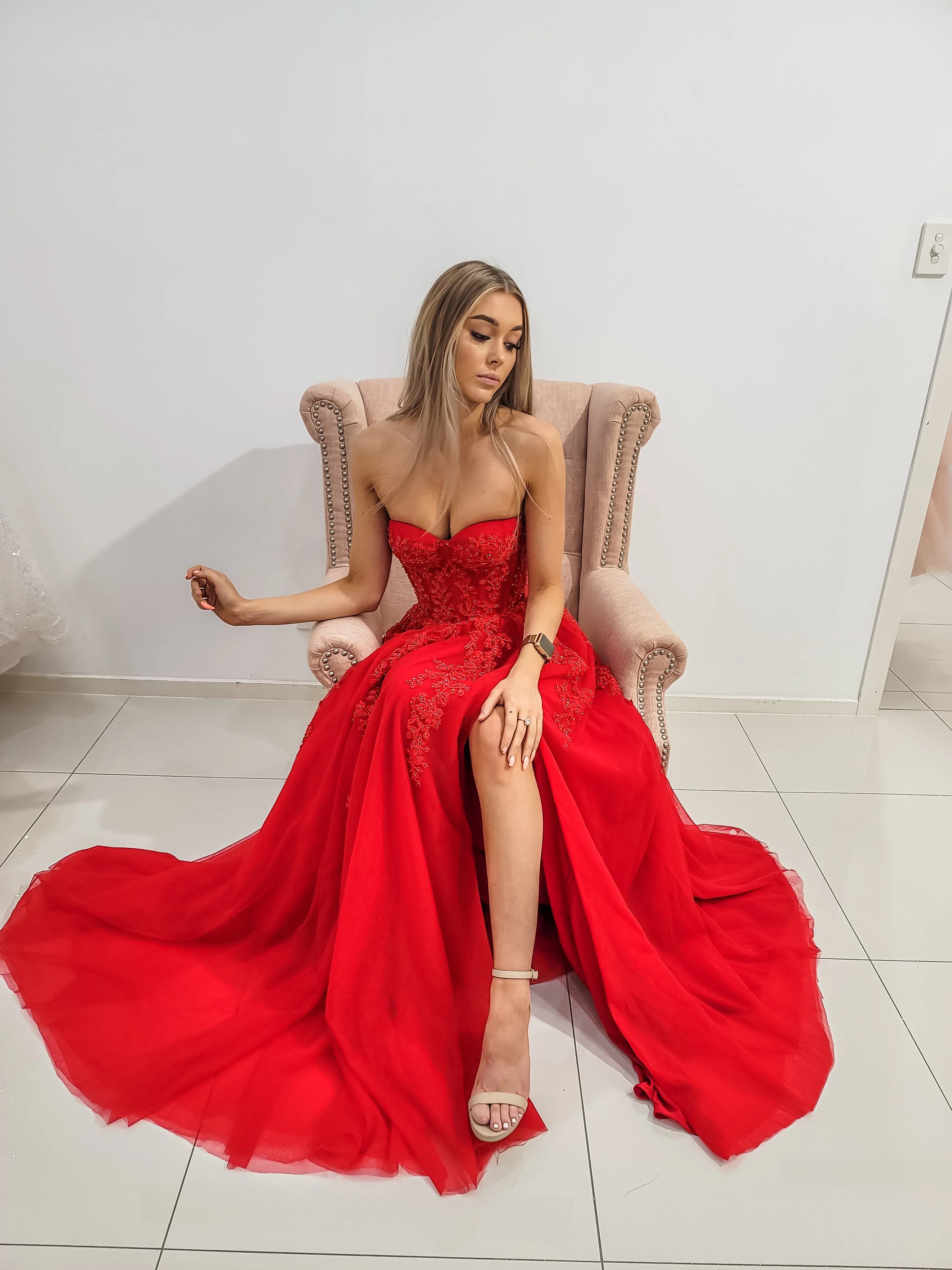 Red bustier top tulle dress with slit for hire