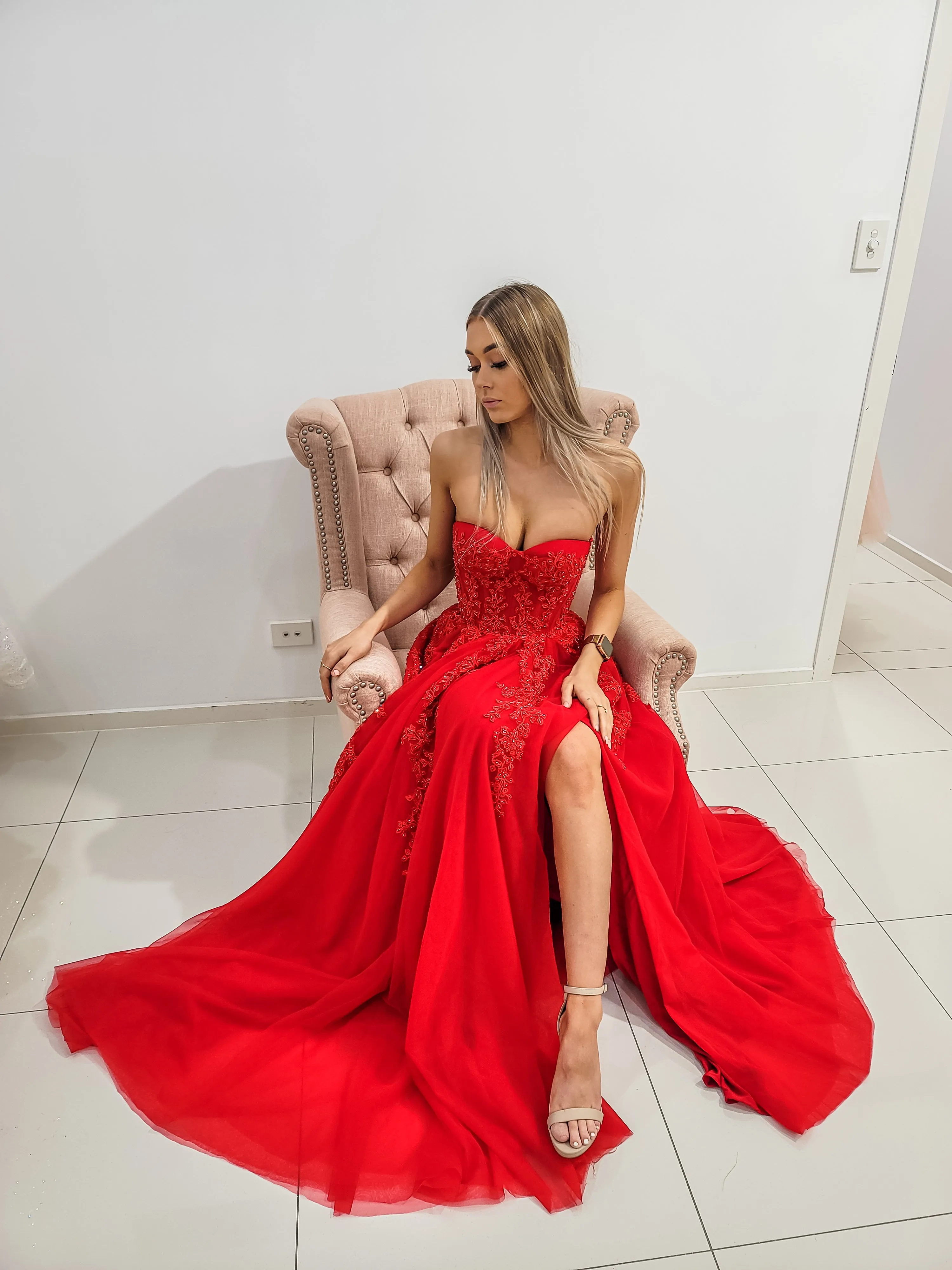 Red bustier top tulle dress with slit for hire