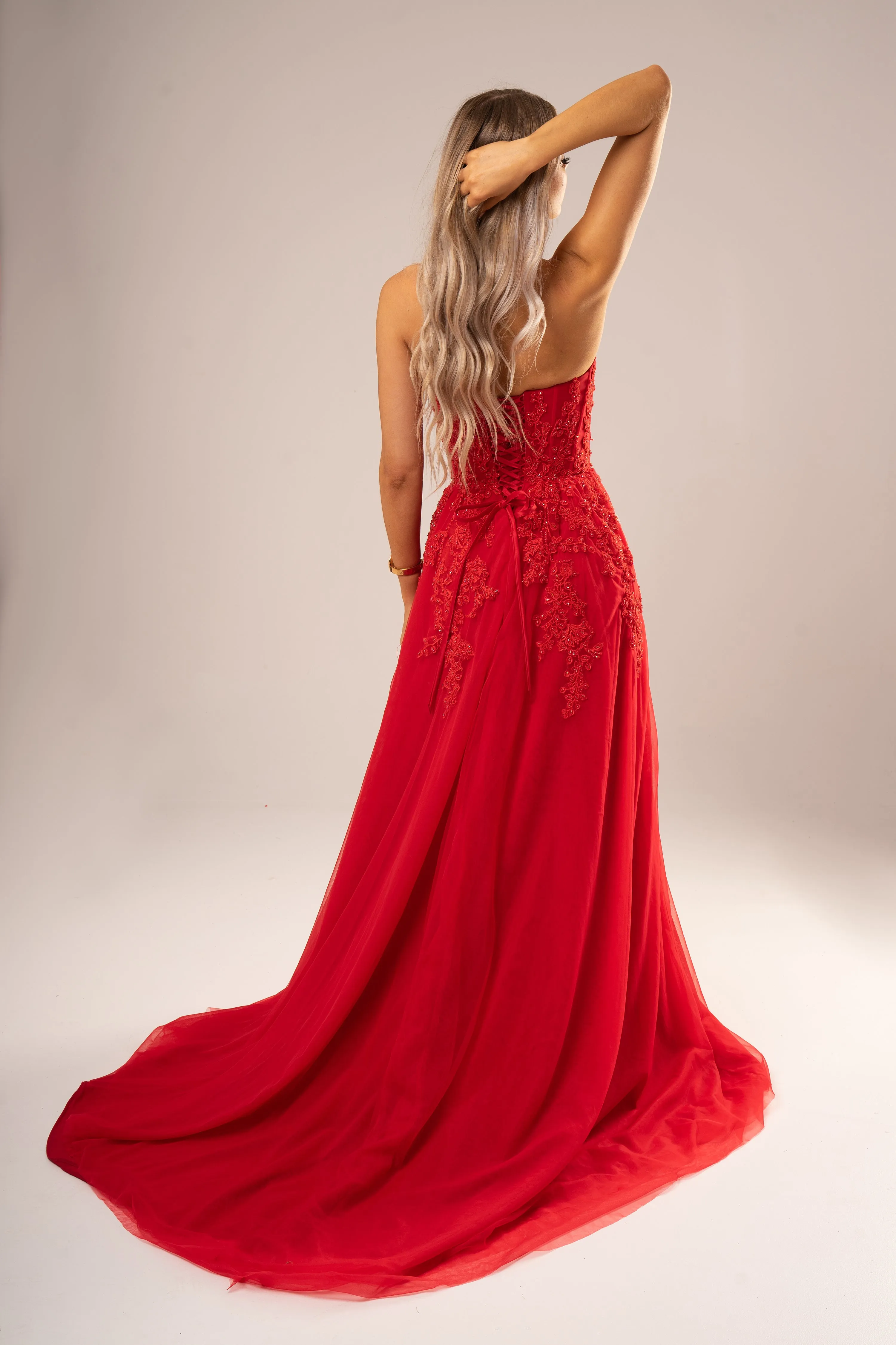 Red bustier top tulle dress with slit for hire